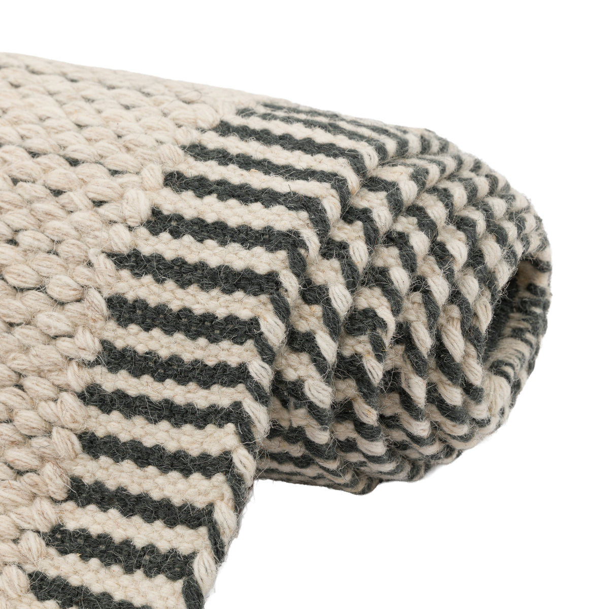Gallery Direct Valena Border Rug Ecru - rolled rug showing weave and pile texture