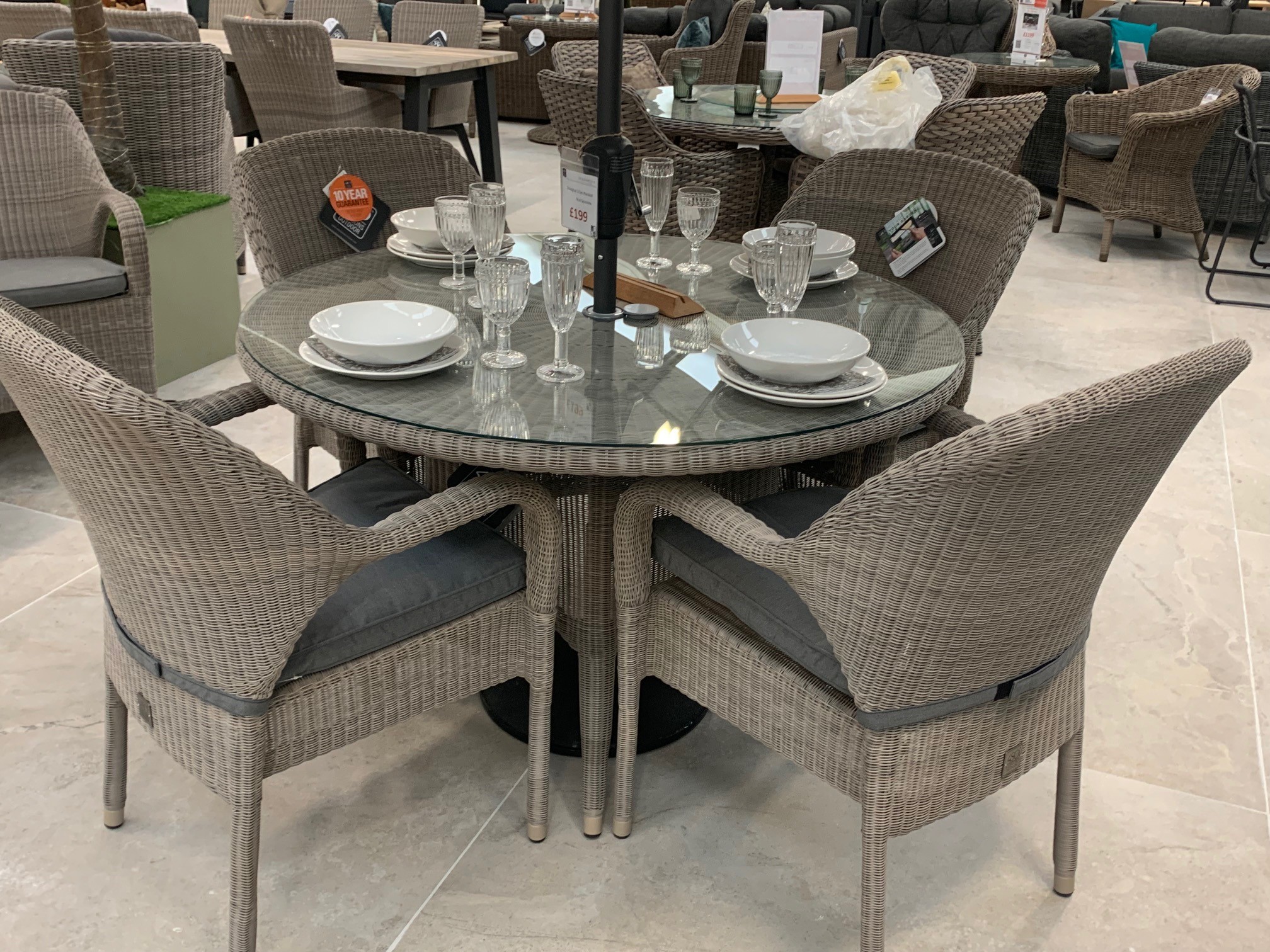 4 Seasons Outdoor Sussex 4 Seat Stacking Dining Set in Polyloom Pebble