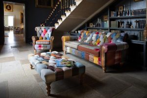 Dickinson 2 Seat Large Sofa In Patchwork  Tan Leather With Mid Oak Legs | Shackletons